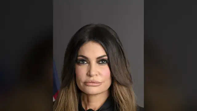 Kimberly Guilfoyle with long dark hair in her official ambassador portrait