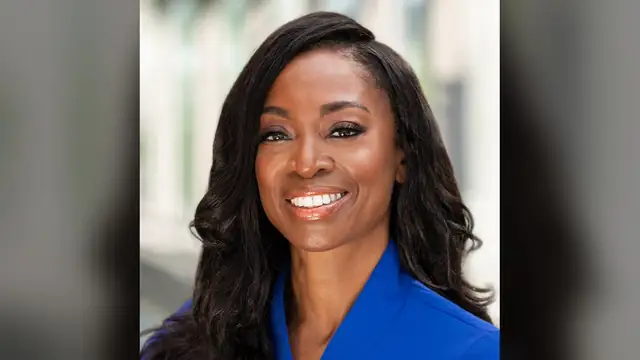 Portrait of CDC Director Dr. Erica Schwartz smiling in a blue blouse against a softly blurred background