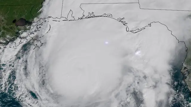 Satellite image of Hurricane Isaias as a huge white spiral of clouds over the northern Gulf off the Alabama and Florida coasts