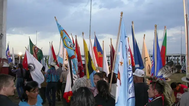 Tribal nation flags carried at a powwow in Eagle Butte, South Dakota, on the Cheyenne River Sioux Reservation