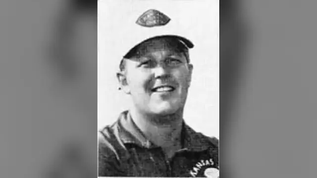 John Beake in a Kansas City Chiefs cap and shirt in a 1970s team photo from his time as a Chiefs assistant coach