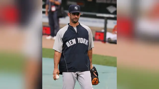 Jorge Posada in a New York Yankees pullover on the field in 2009