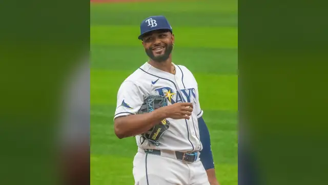 Junior Caminero smiling on the field in a Rays uniform