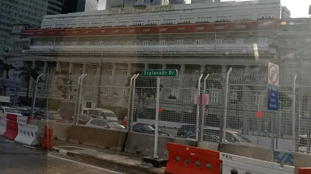 Concrete barriers and fencing lining a city street ahead of the Singapore Grand Prix