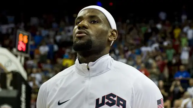 LeBron James in a white Team USA warmup jacket standing for the national anthem before a 2012 exhibition game in Las Vegas