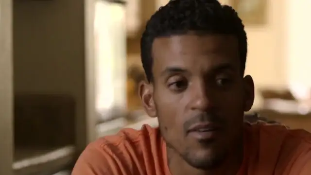 Matt Barnes in an orange T-shirt during a sit-down interview