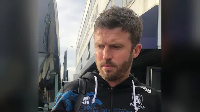 Michael Carrick in a dark Middlesbrough club jacket outside the team bus after a match in April 2025
