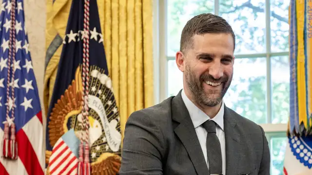 Nick Sirianni smiling in a gray suit in the Oval Office during the Eagles' 2025 White House visit