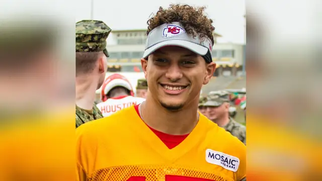 Patrick Mahomes in a Chiefs camouflage hoodie at a 2018 military appreciation event