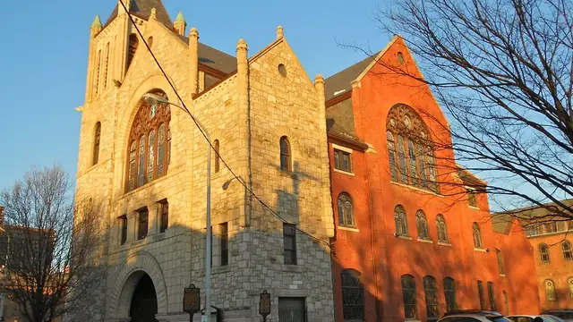 Brick facade of Mother Bethel AME Church on a Philadelphia street corner under a bright sky
