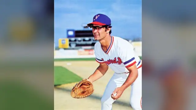 A young Don Mattingly in a Nashville Sounds uniform and cap crouches near first base with his glove ready
