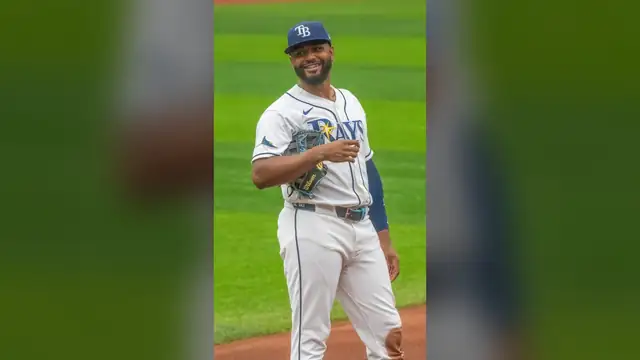 Tampa Bay Rays third baseman Junior Caminero smiles on the field in a Rays home uniform during a June 2026 game