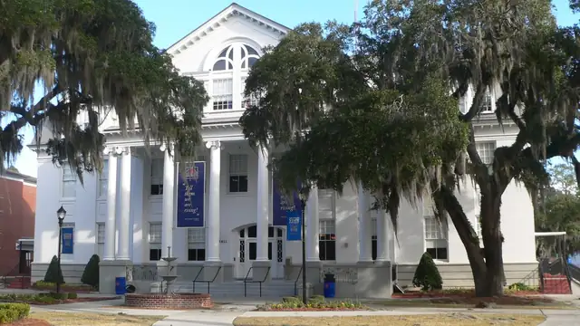 White-columned Hill Hall framed by live oak trees on the Savannah State University campus in Georgia