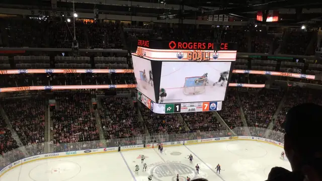 Fans fill Rogers Place in Edmonton during a March 2017 Oilers hockey game as the center video board flashes a goal