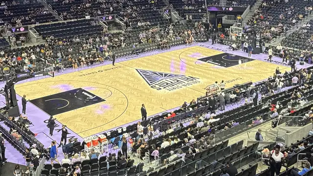 The Golden State Valkyries logo sits at center court at Chase Center in San Francisco as fans find their seats in the violet-trimmed arena