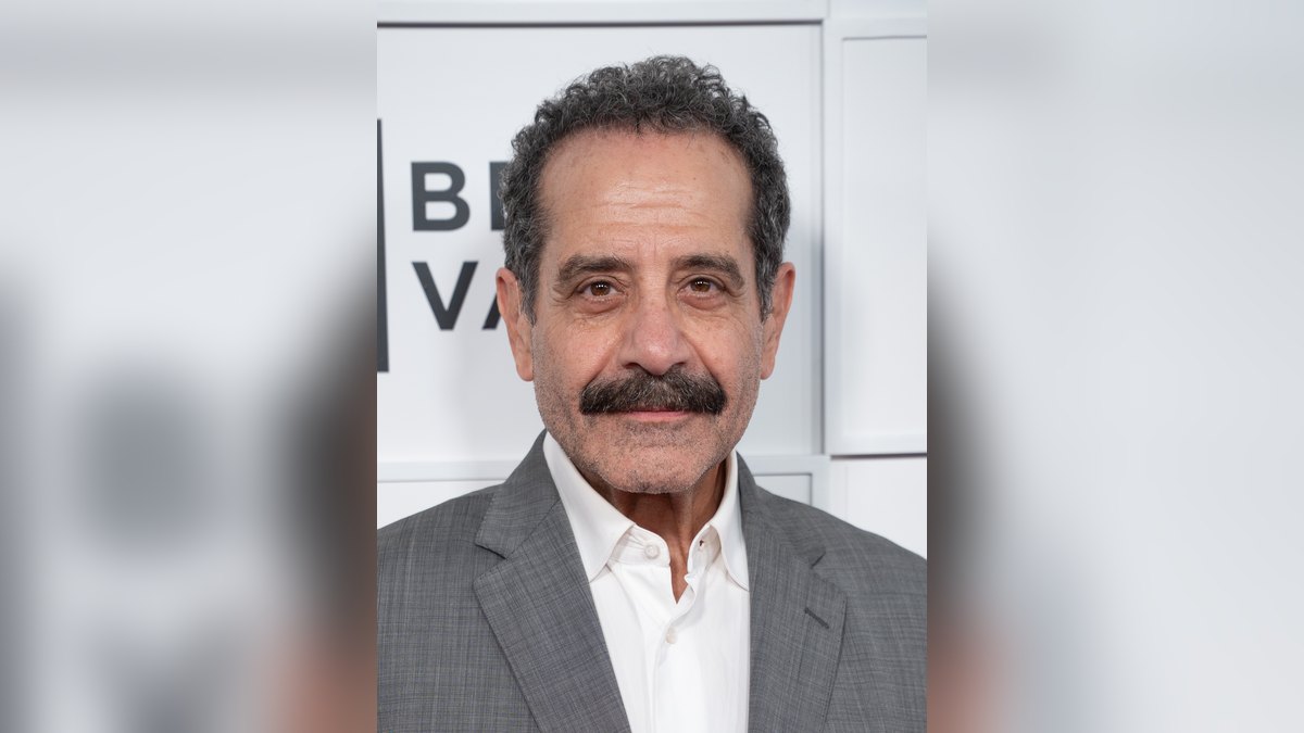 Tony Shalhoub in a gray suit at the Tribeca Festival