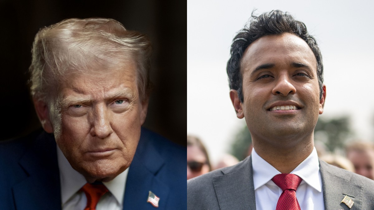 Donald Trump in a navy suit and red tie beside a smiling Vivek Ramaswamy in a gray suit and red tie