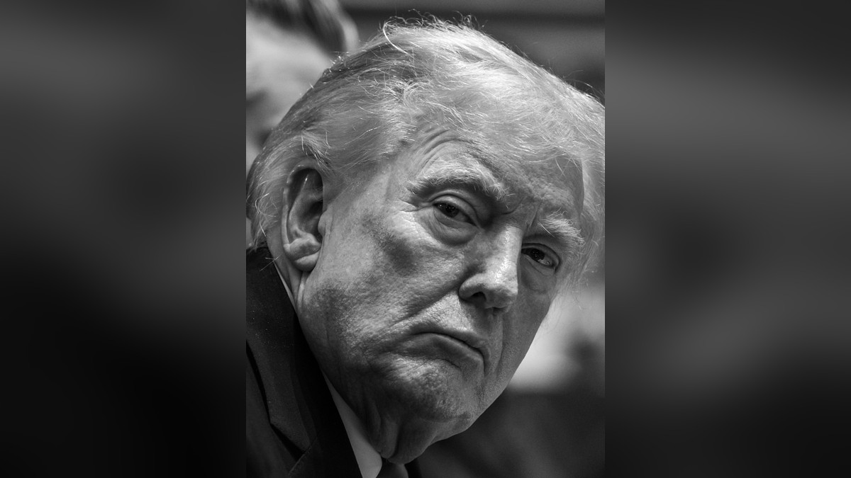 Donald Trump listening during a meeting at the White House