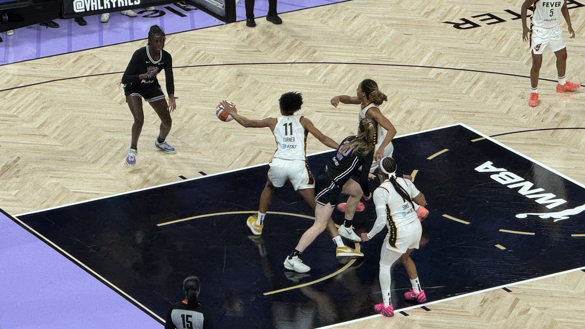 Golden State Valkyries players in black uniforms defend on the purple-trimmed Chase Center floor during a home game in San Francisco