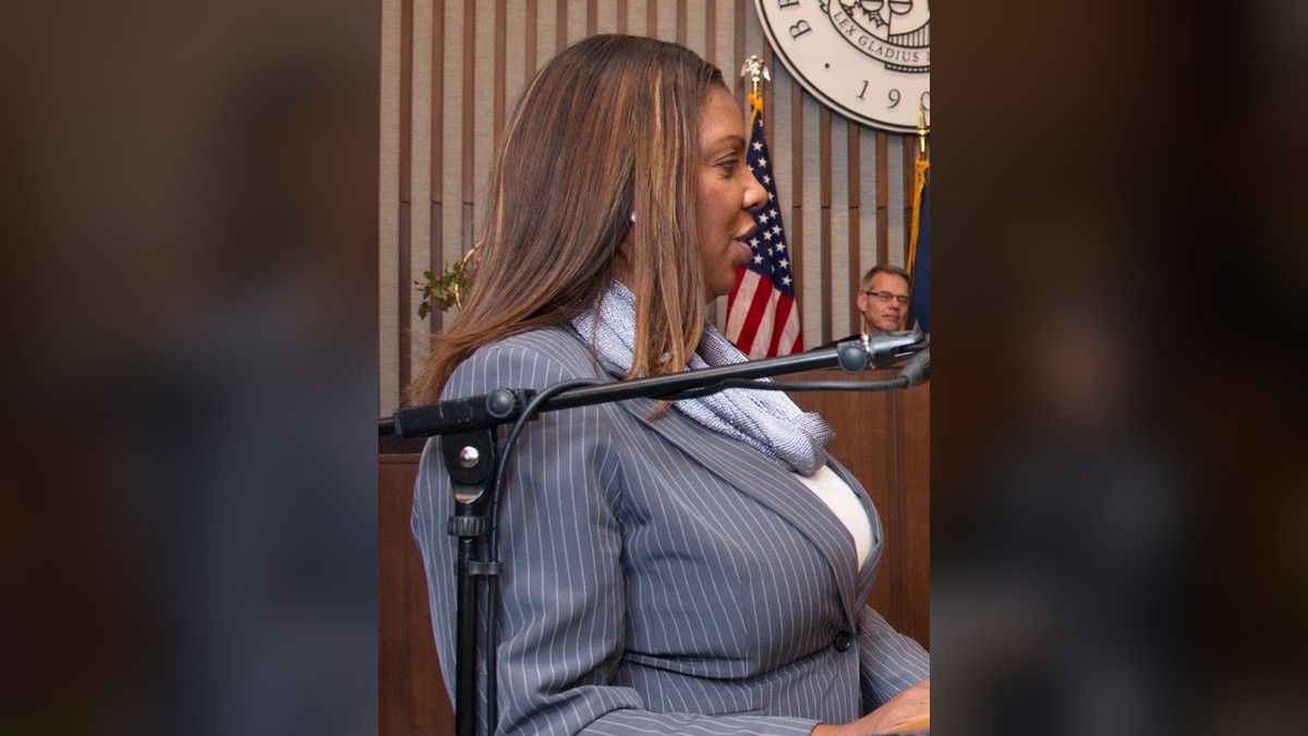 New York Attorney General Letitia James speaking at a podium